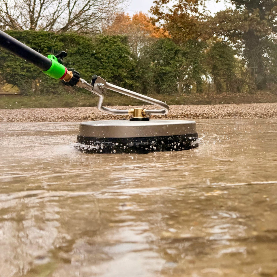 12" Turbo Devil Flat Surface Cleaner with GVS Power Pole 20ft being used to clean a concrete driveway.