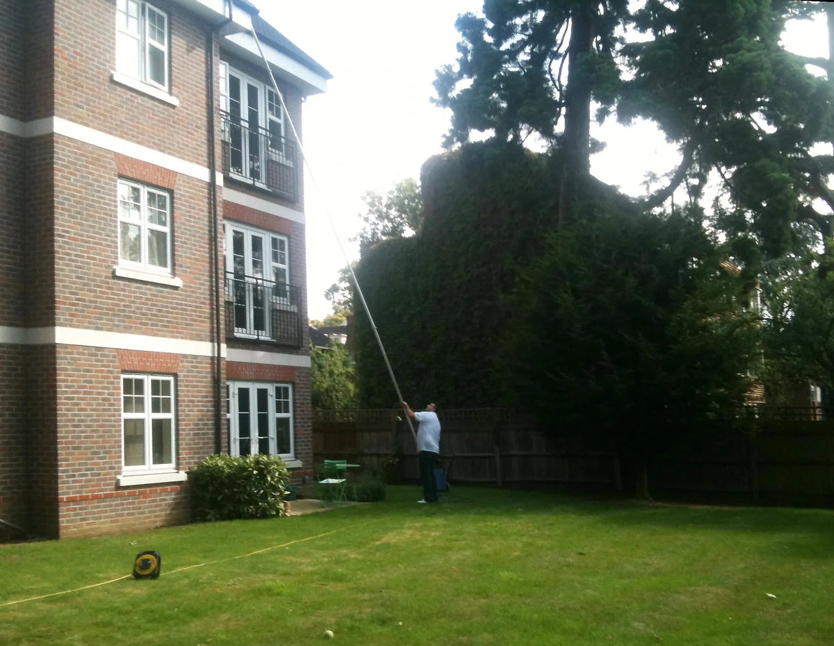 Aquafed exterior cleaning work before Gutter Vacuum Systems specialist equipment supply