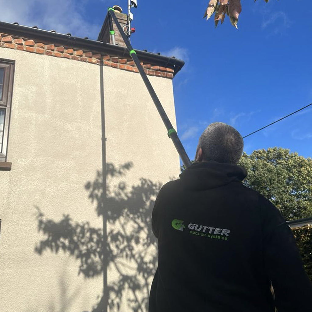 Mark from Gutter Vacuum Systems Clearing Gutters with the 51mm Rigid Neck Clamped Carbon Gutter