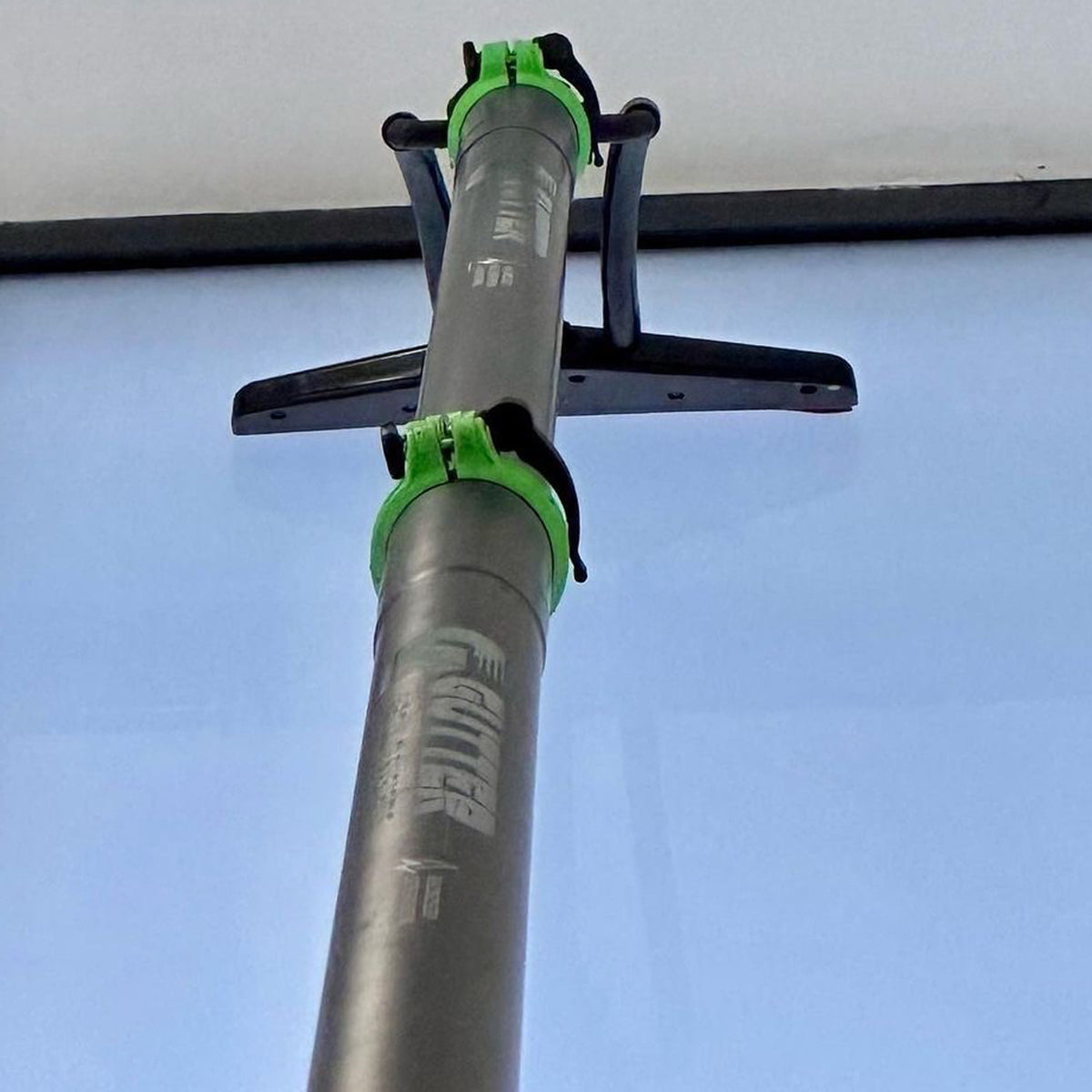 Vakhead being used with GVS clamped carbon poles to clean high level internal glass